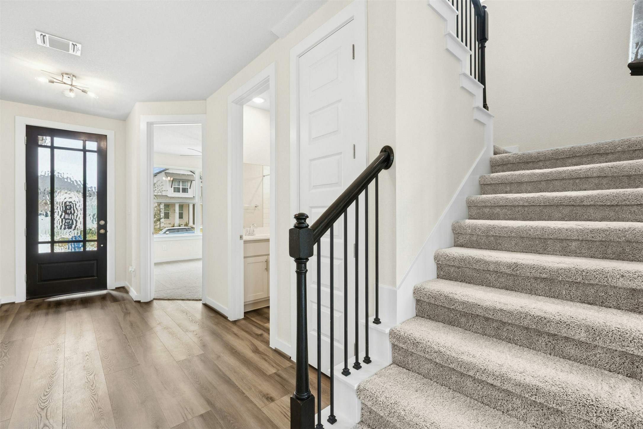 4313 Contrail Lane Round Rock, TX 78665 - Photo 14 of 32 a view of staircase with wooden floor and fan