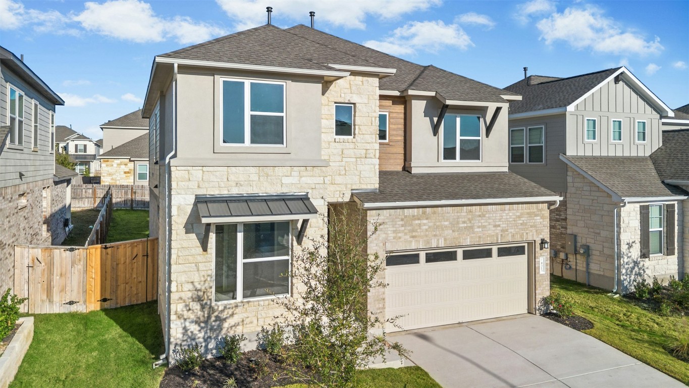 4313 Contrail Lane Round Rock, TX 78665 - Photo 2 of 32 a front view of a house with a yard