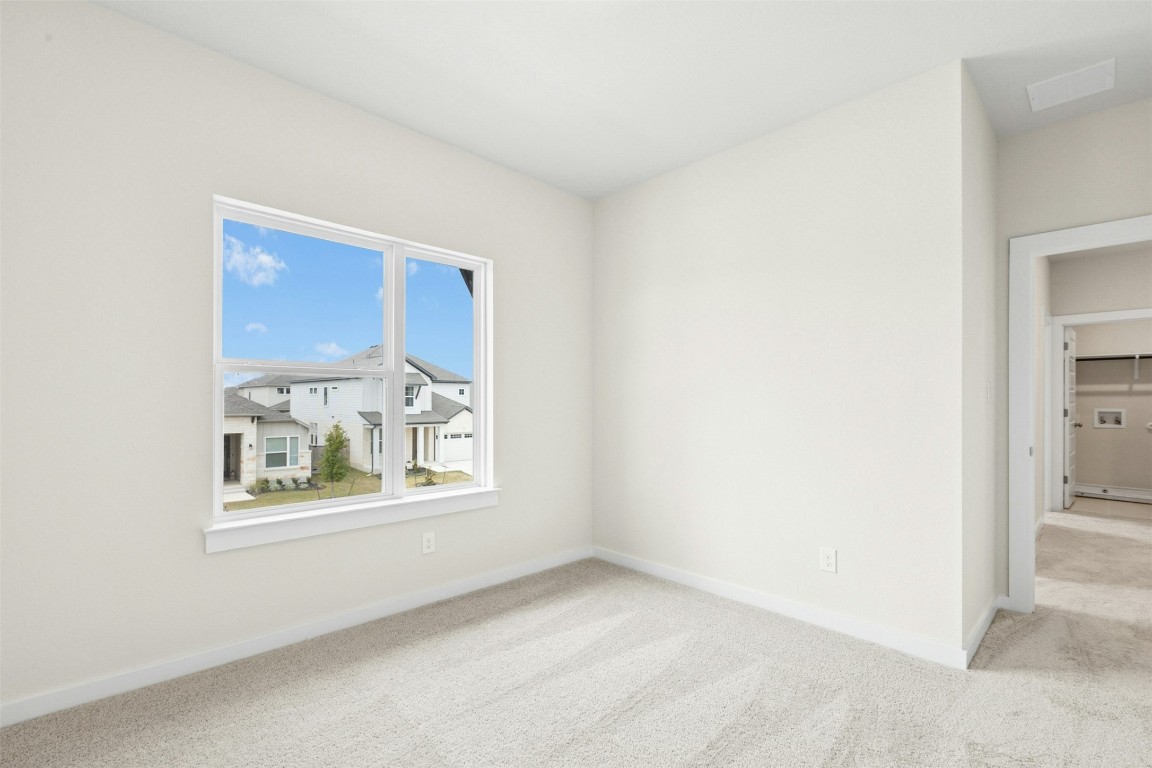 4313 Contrail Lane Round Rock, TX 78665 - Photo 21 of 32 a view of an empty room with a window