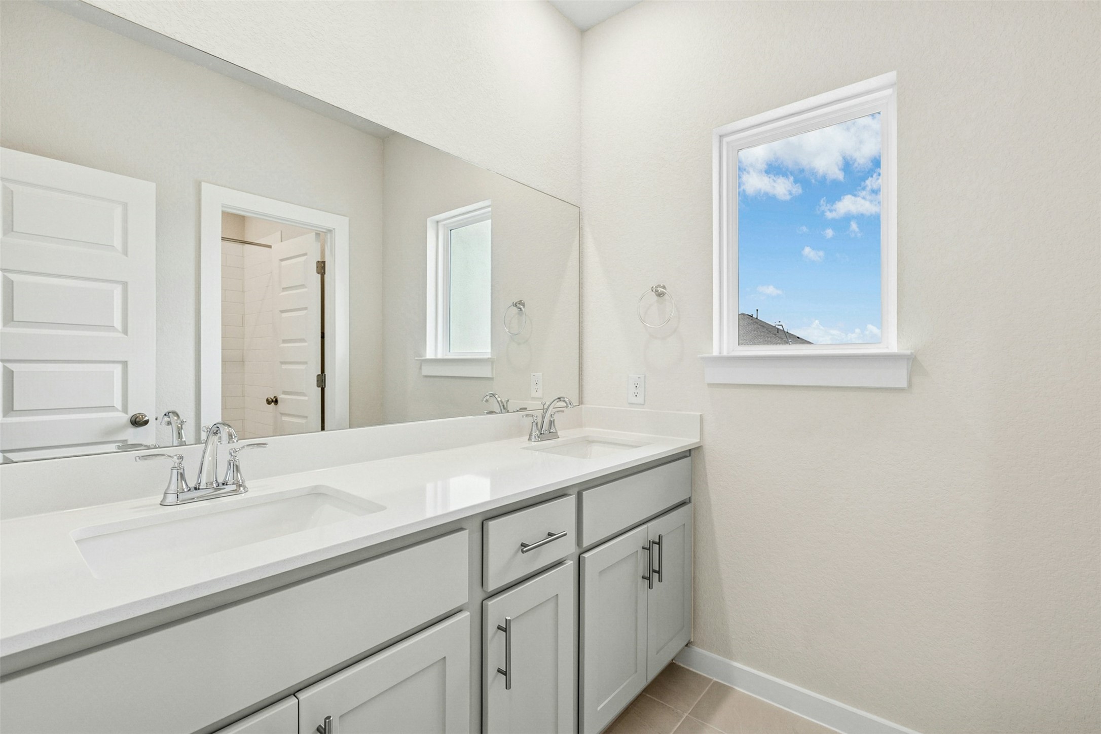 4313 Contrail Lane Round Rock, TX 78665 - Photo 27 of 32 a bathroom with a sink and a mirror