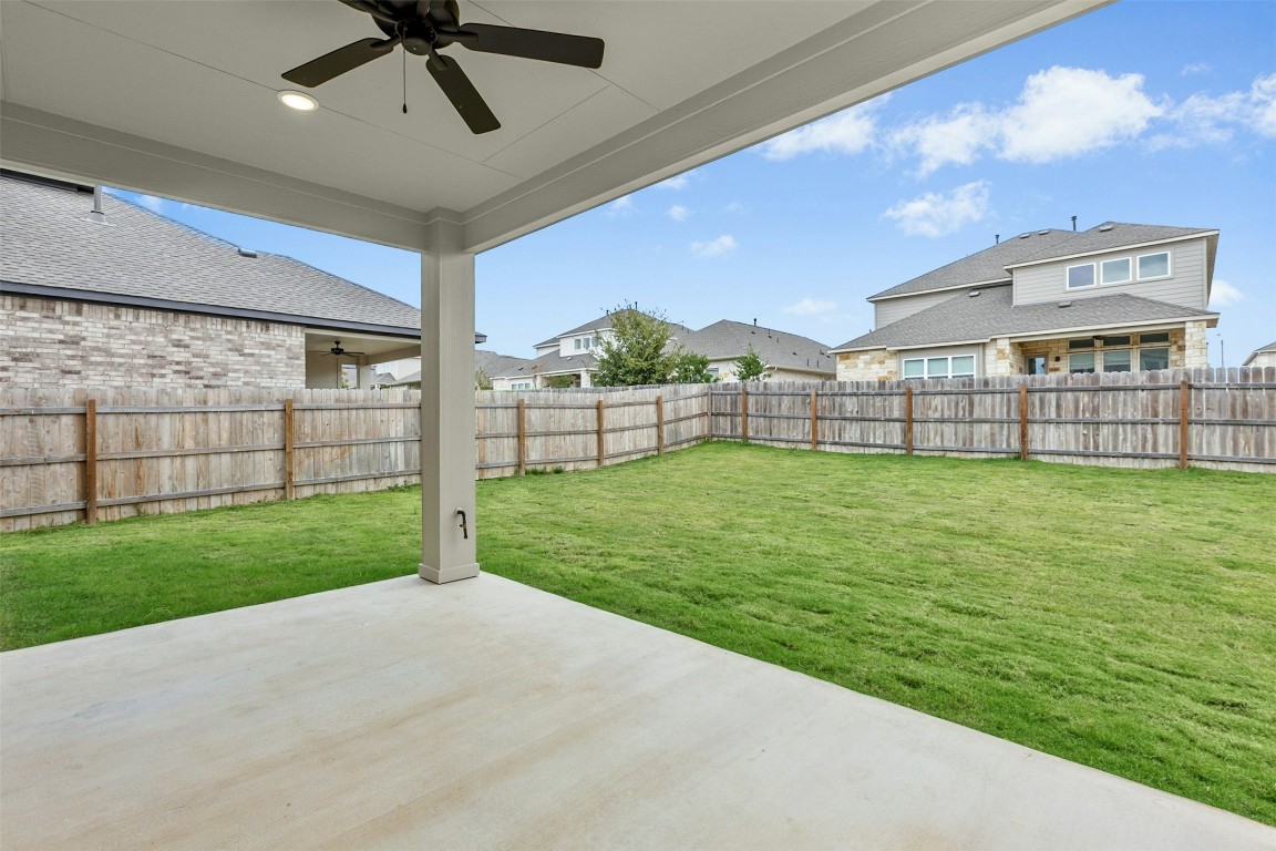 4313 Contrail Lane Round Rock, TX 78665 - Photo 28 of 32 a view of a backyard with a garden and plants