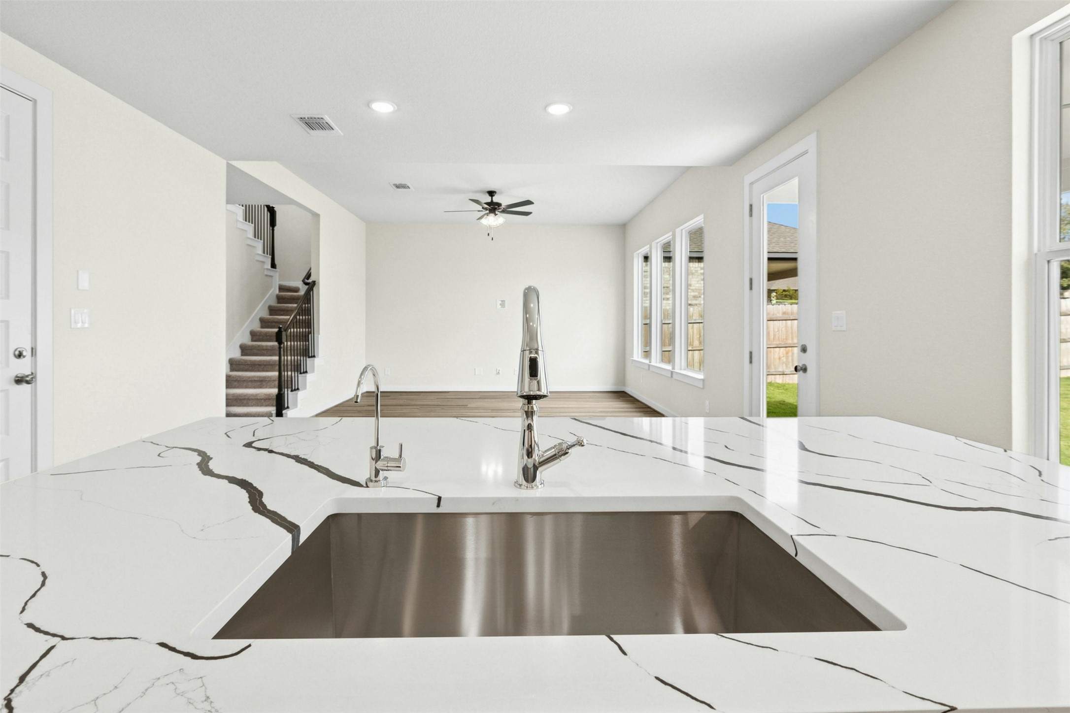 4313 Contrail Lane Round Rock, TX 78665 - Photo 10 of 32 a kitchen with a sink and a refrigerator