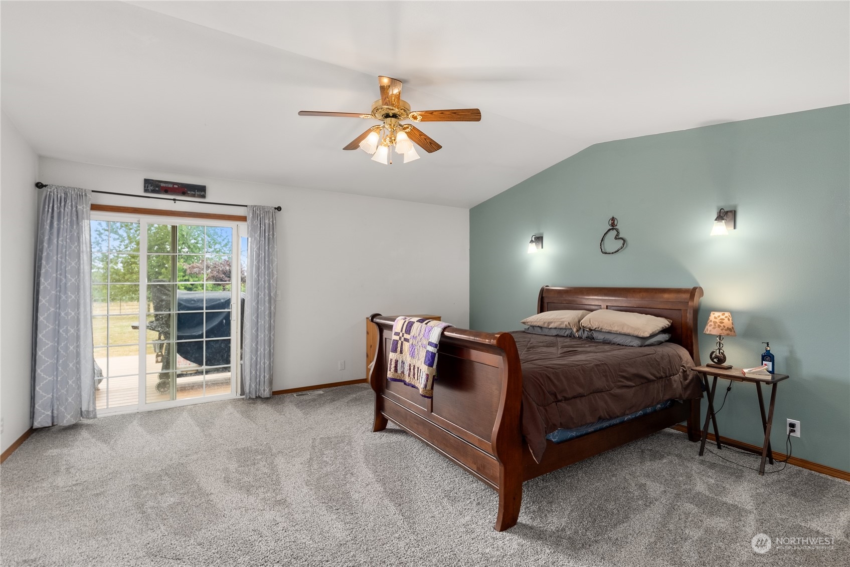 169 Conradi Road Winlock, WA 98596 - Photo 14 of 38 a bedroom with a bed and a large window