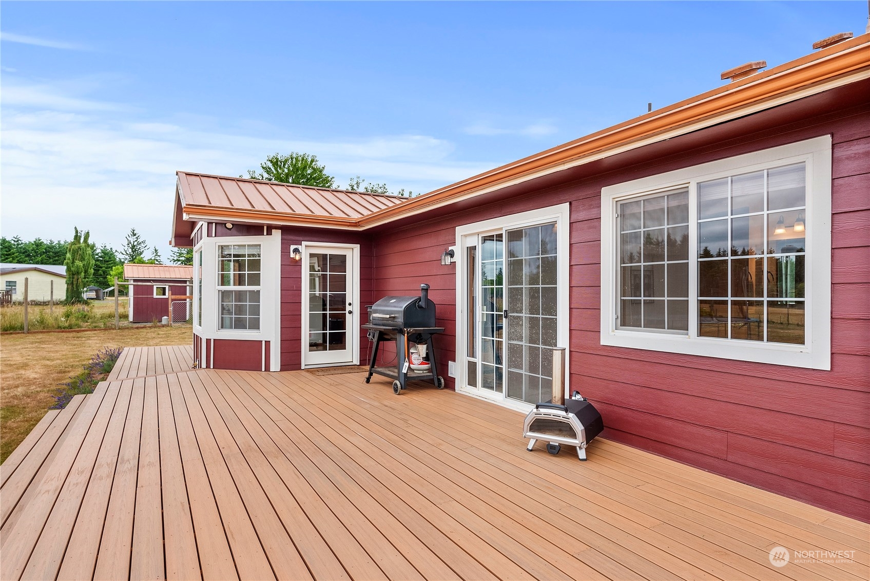 169 Conradi Road Winlock, WA 98596 - Photo 23 of 38 a view of house with deck outdoor seating and wooden floor
