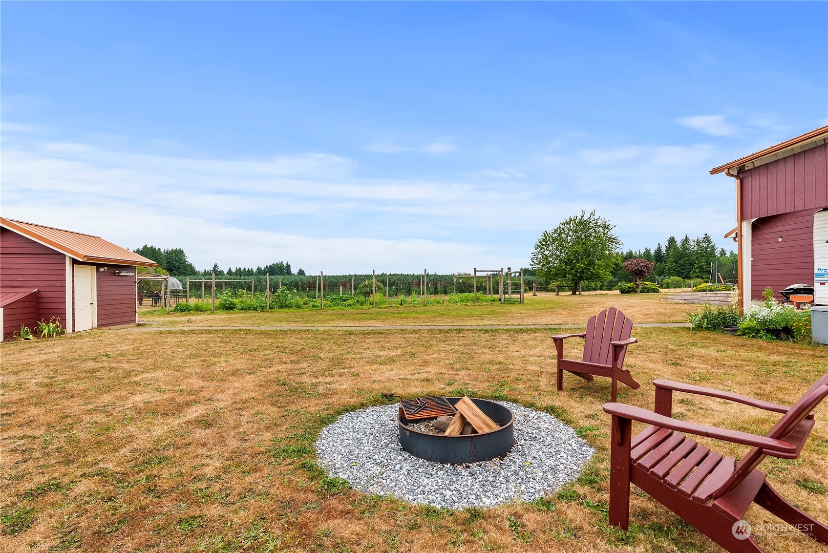 169 Conradi Road Winlock, WA 98596 - Photo 29 of 38 a view of a lake with a table and chairs under an umbrella