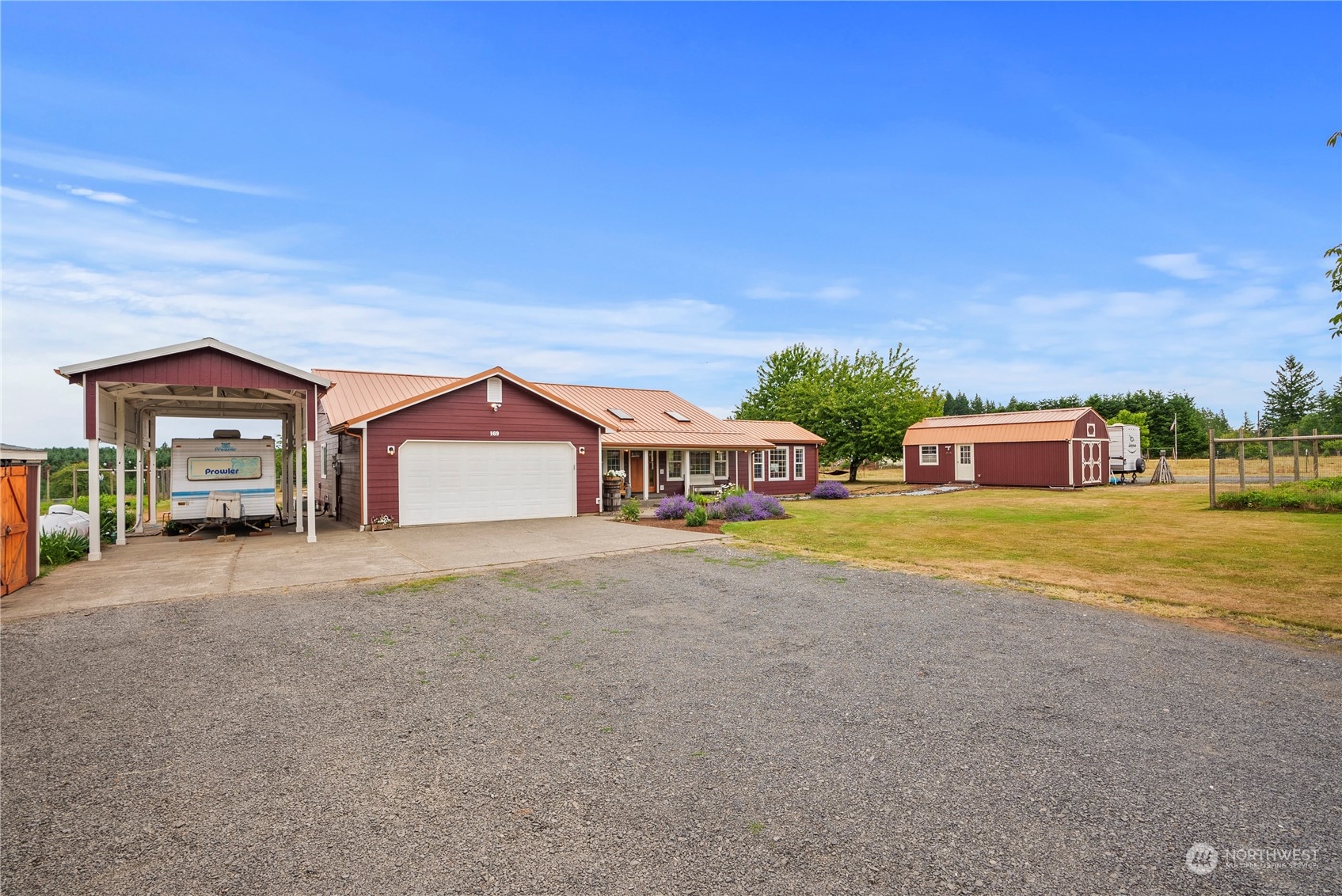 169 Conradi Road Winlock, WA 98596 - Photo 34 of 38 a front view of a house with a yard and table and chairs
