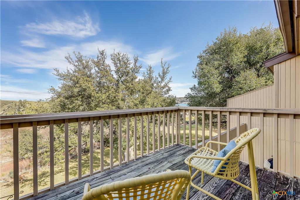 133 Comanche Drive Point Venture, TX 78645 - Photo 16 of 32 Balcony directly off of primary bedroom