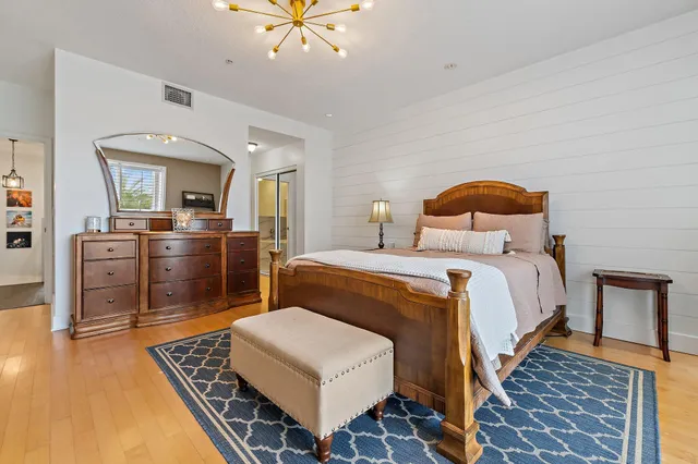 a bedroom with a bed and furniture