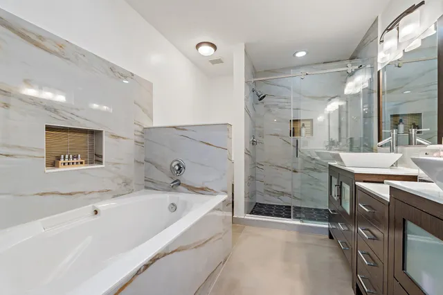 a bathroom with a bathtub and a sink