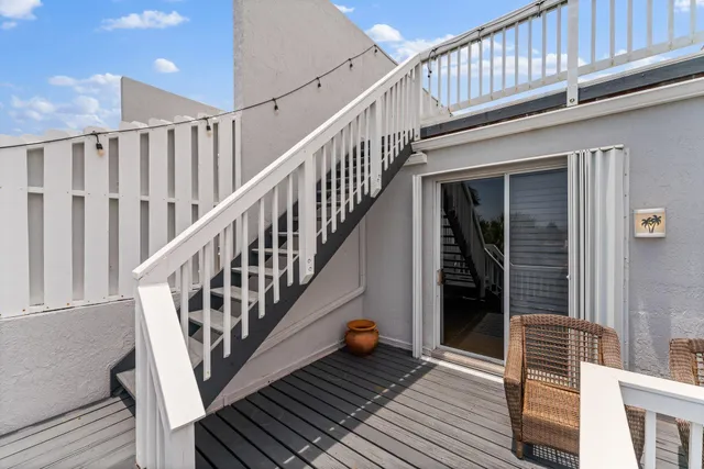 a view of staircase with wooden floor and fence