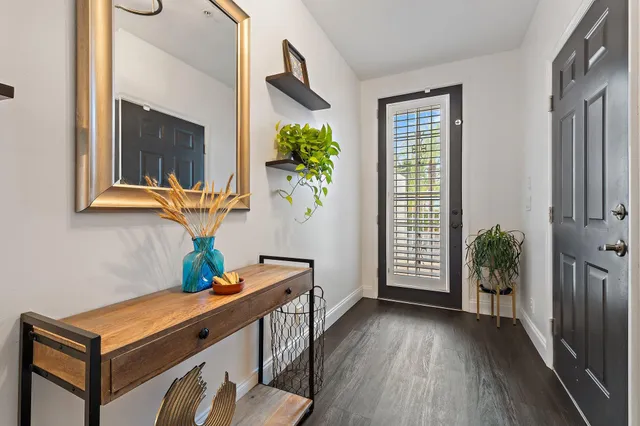 a view of an entryway with wooden floor