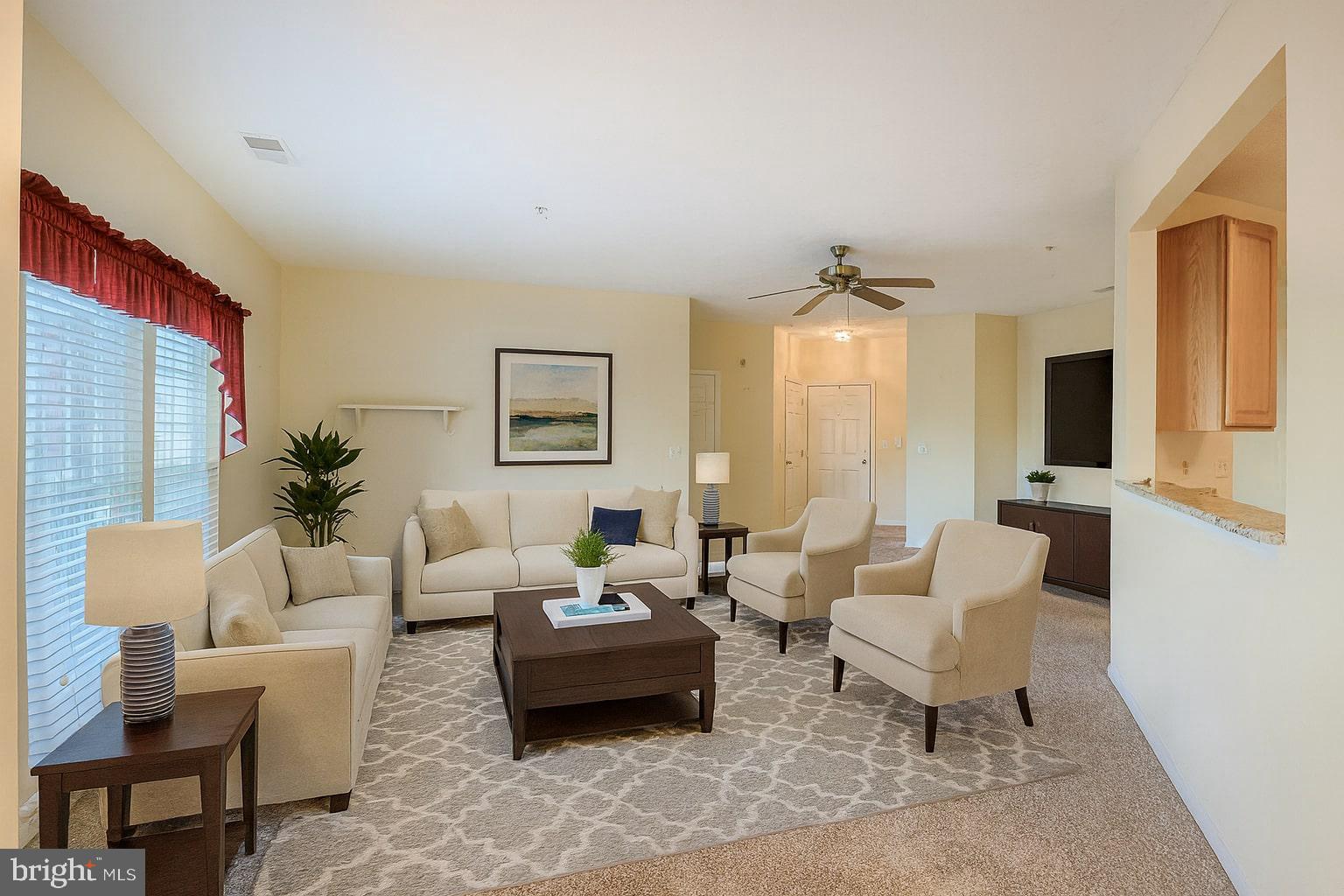 5488 Glenthorne Court, Unit 5488 Baltimore, MD 21237 - Photo 11 of 39 a living room with furniture and a large window
