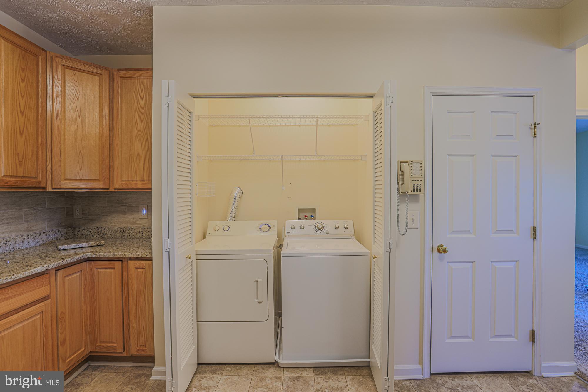 5488 Glenthorne Court, Unit 5488 Baltimore, MD 21237 - Photo 18 of 39 a view of bathroom with washer and dryer
