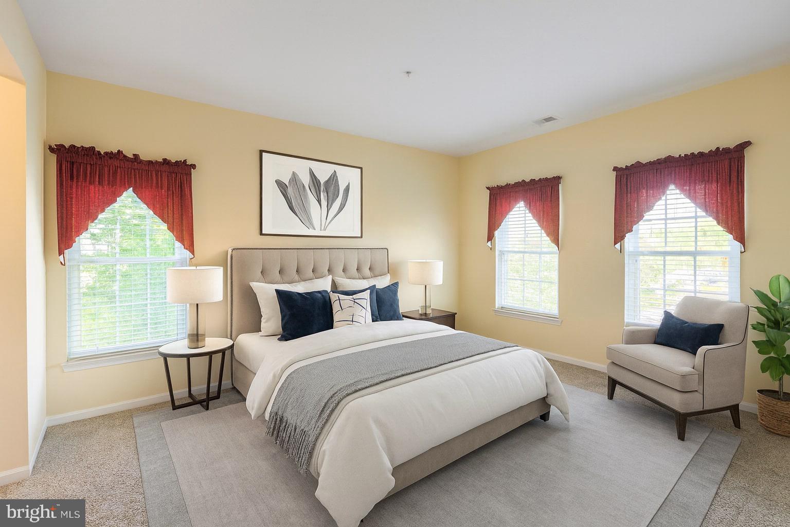 5488 Glenthorne Court, Unit 5488 Baltimore, MD 21237 - Photo 23 of 39 a bedroom with bed and a couch