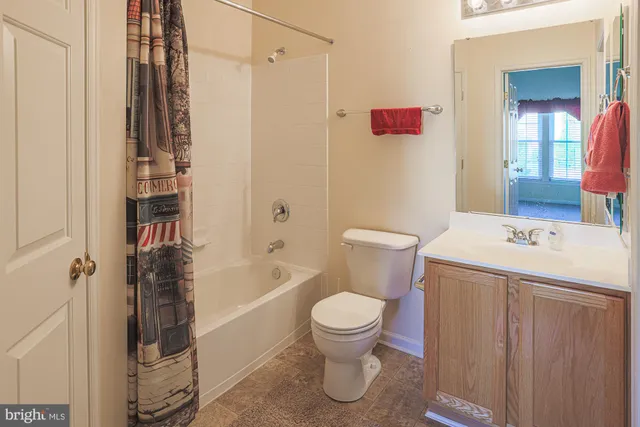 a bathroom with a sink a toilet and a bathtub