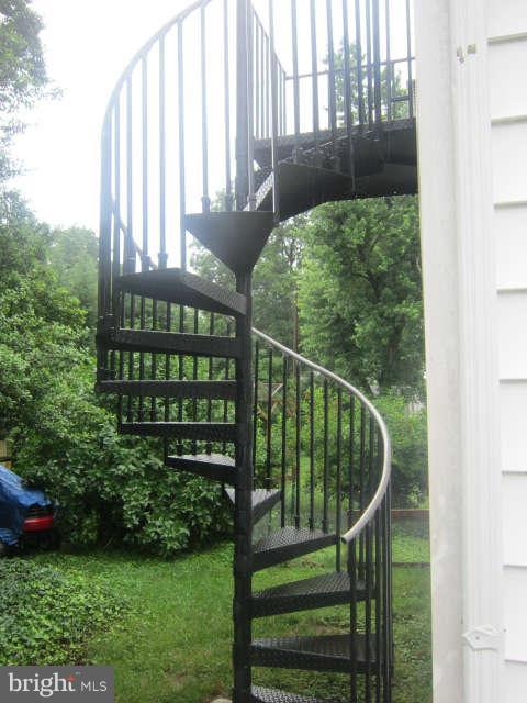 9108 Sudley Road Manassas, VA 20110 - Photo 23 of 30 Stair to room above garage