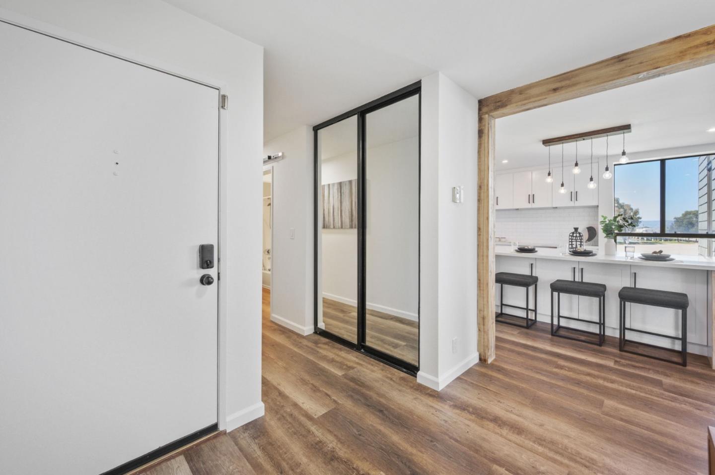 425 Anchor Road, Unit 317 San Mateo, CA 94404 - Photo 12 of 53 a view of kitchen with empty room and wooden floor
