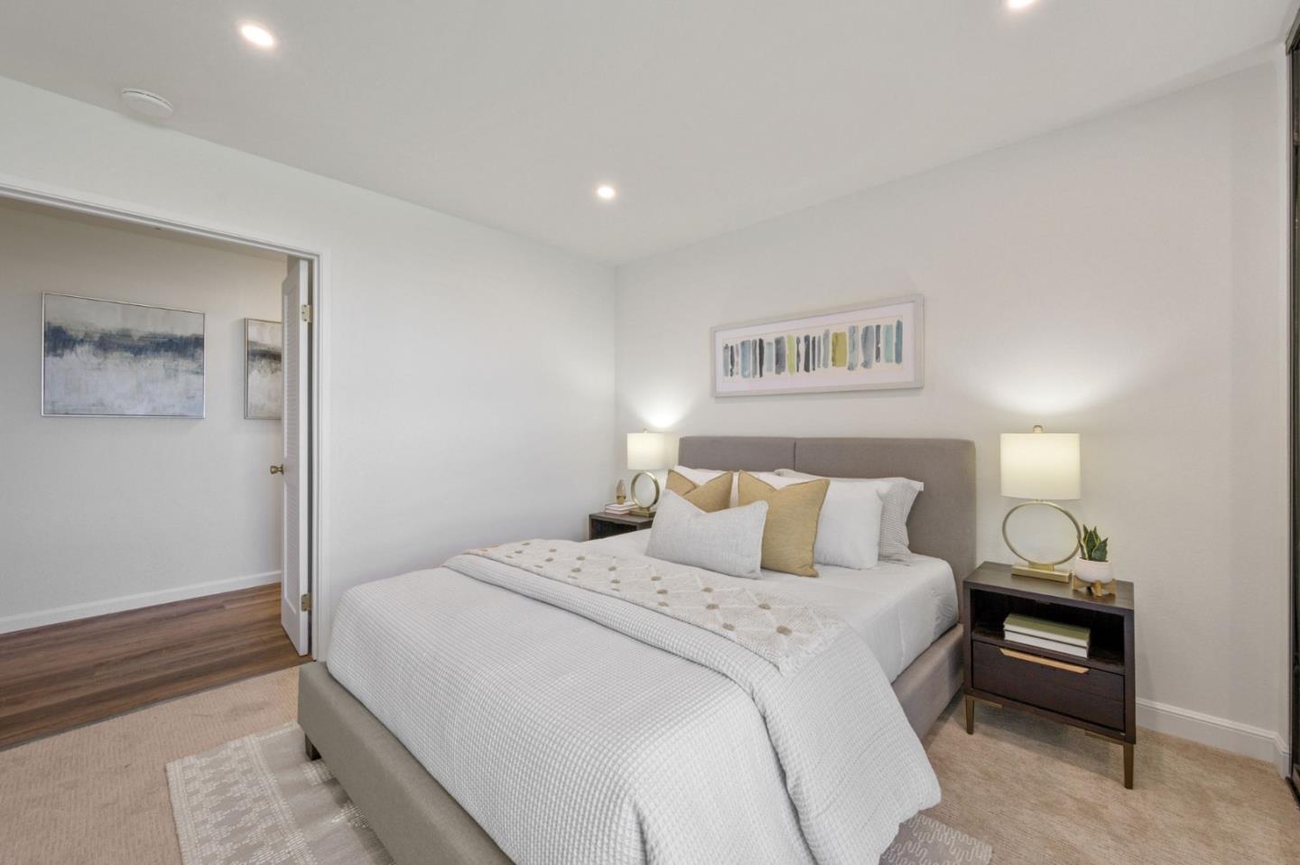 425 Anchor Road, Unit 317 San Mateo, CA 94404 - Photo 29 of 53 a bedroom with a bed and a wall painting