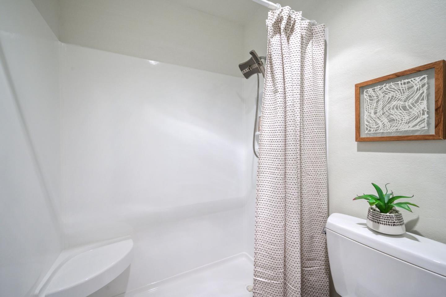 425 Anchor Road, Unit 317 San Mateo, CA 94404 - Photo 41 of 53 a bathroom with a shower curtain