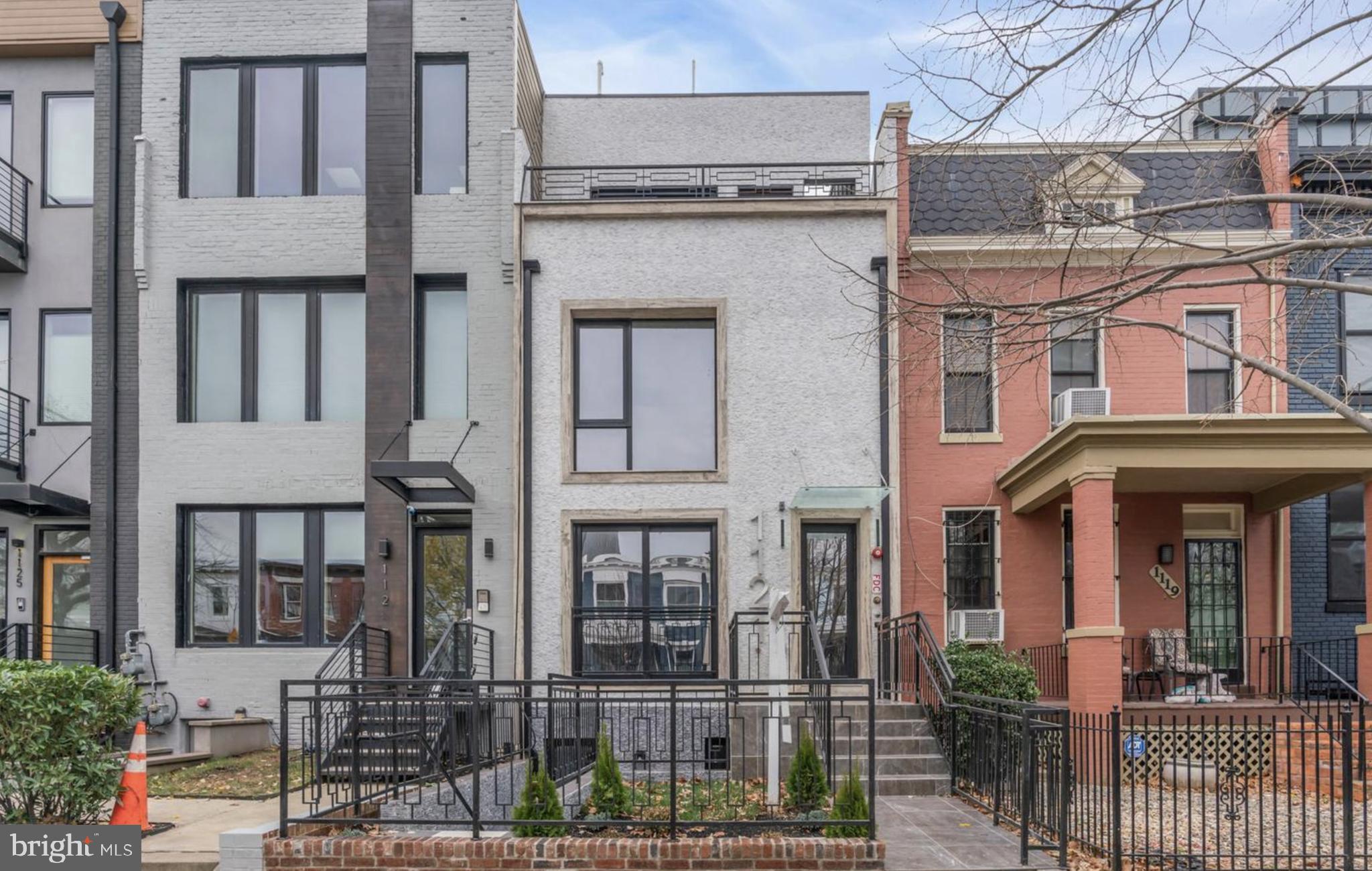 1121 Morse Street Northeast, Unit 3 Washington, DC 20002 - Photo 1 of 25 a view of a brick building with many windows