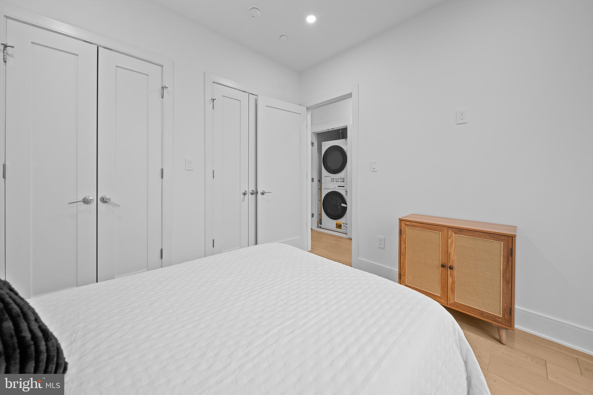 1121 Morse Street Northeast, Unit 3 Washington, DC 20002 - Photo 21 of 25 a bedroom with a bed and cabinets
