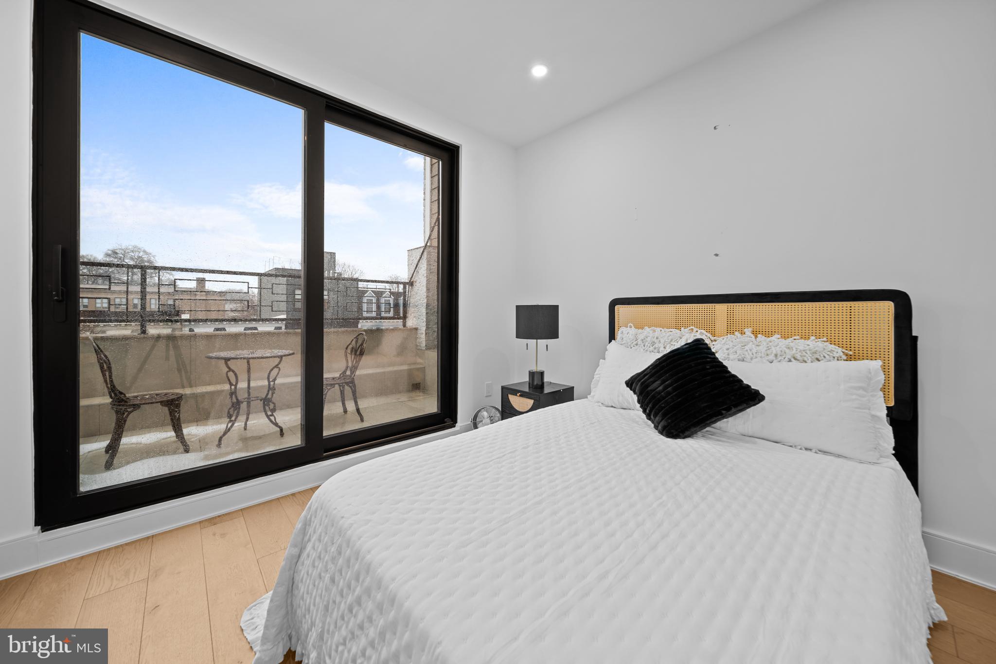 1121 Morse Street Northeast, Unit 3 Washington, DC 20002 - Photo 22 of 25 a bedroom with a large bed and a large window