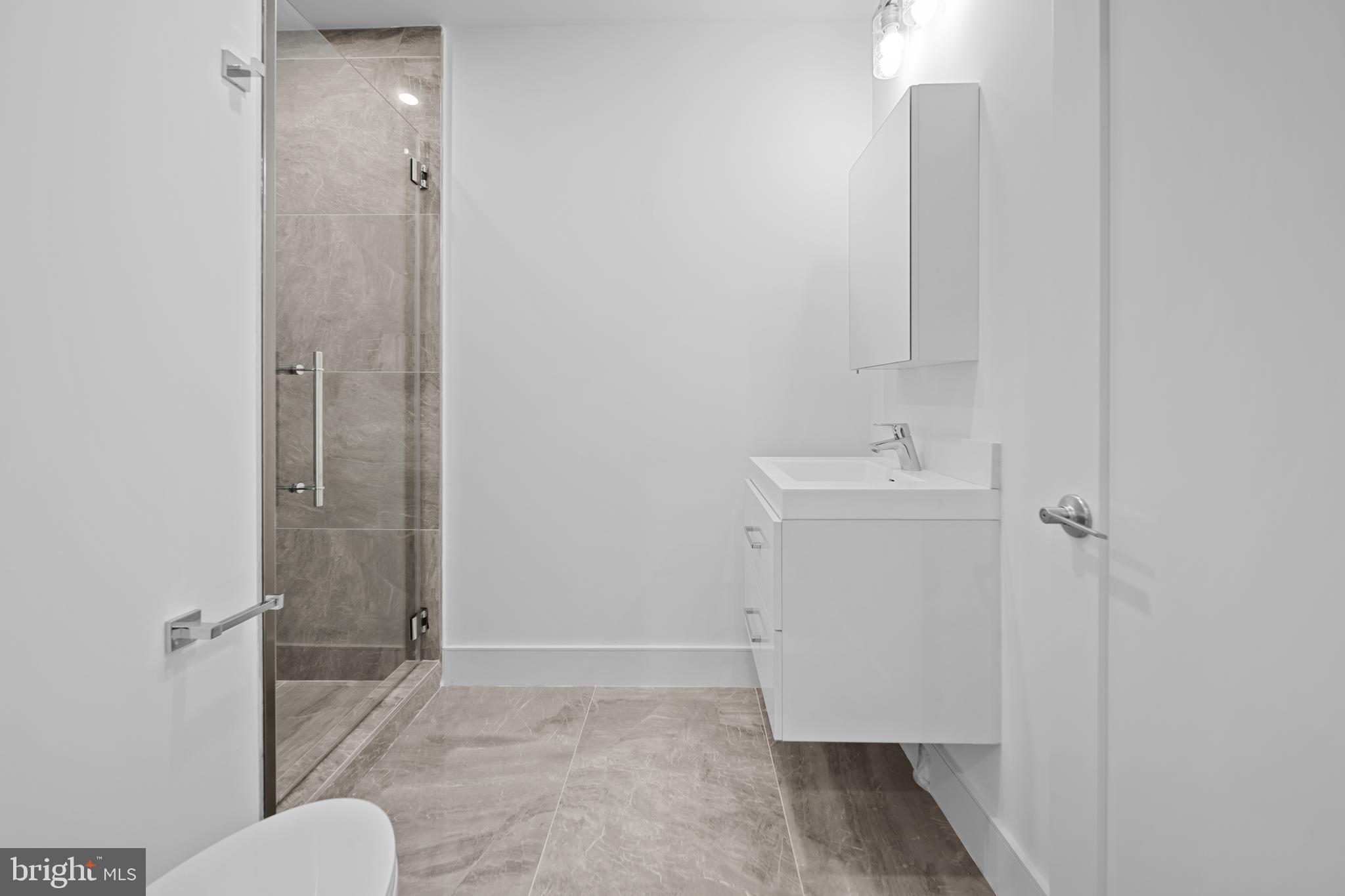 1121 Morse Street Northeast, Unit 3 Washington, DC 20002 - Photo 10 of 25 a bathroom with a sink