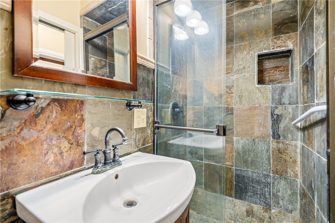 3052 Quail Springs Road, Unit A3 Corpus Christi, TX 78414 - Photo 15 of 27 a bathroom with a sink and a mirror