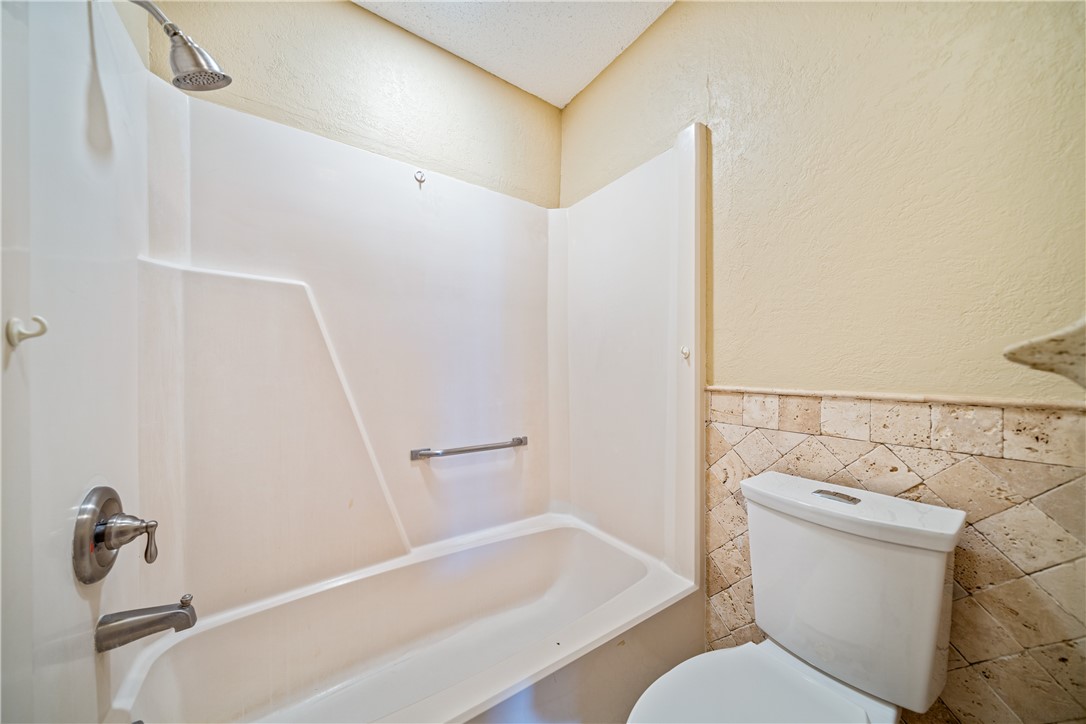 3052 Quail Springs Road, Unit A3 Corpus Christi, TX 78414 - Photo 24 of 27 a bathroom with a sink and toilet