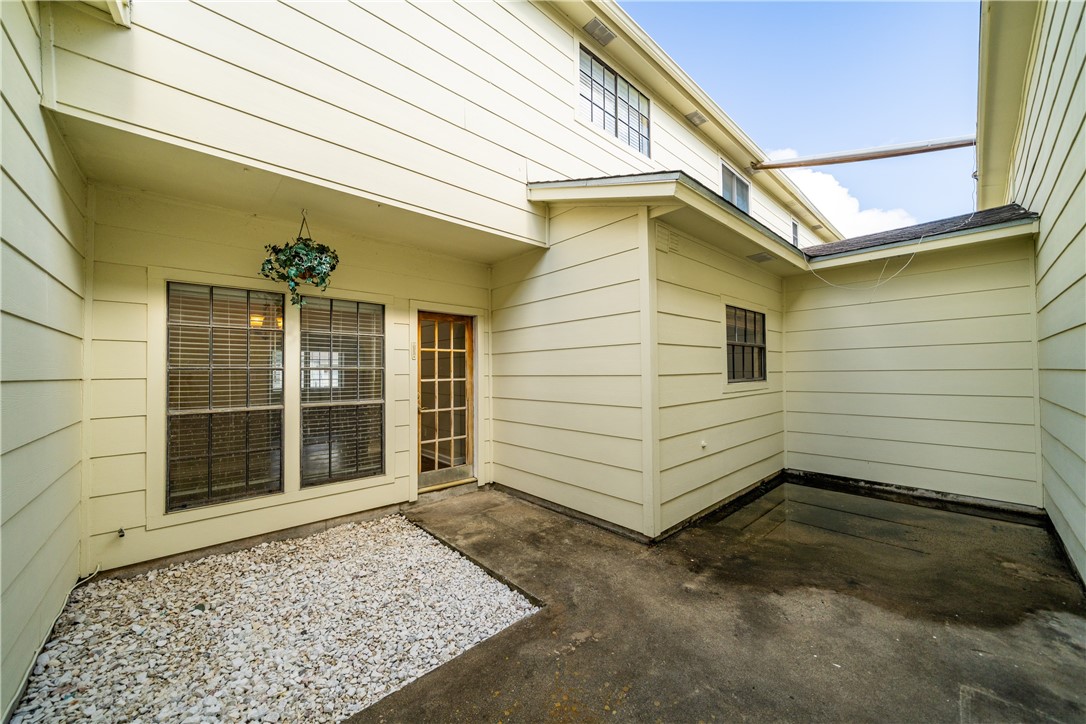 3052 Quail Springs Road, Unit A3 Corpus Christi, TX 78414 - Photo 25 of 27 a view of a house with a door