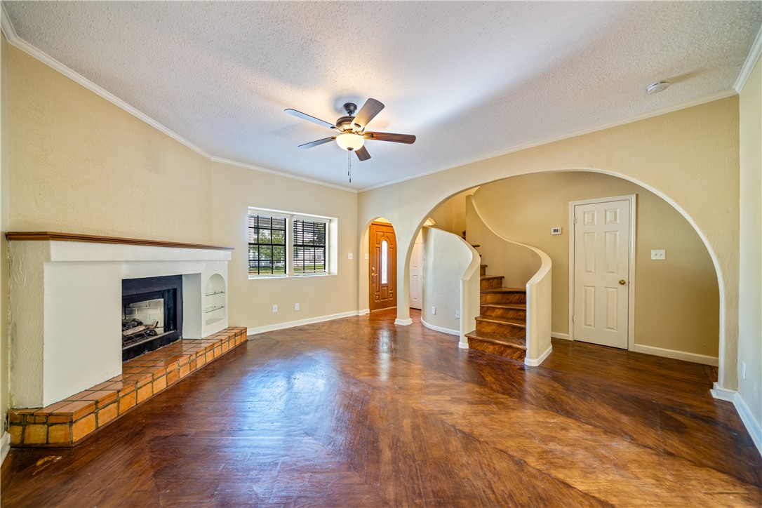 3052 Quail Springs Road, Unit A3 Corpus Christi, TX 78414 - Photo 3 of 27 a view of empty room with wooden floor and fan