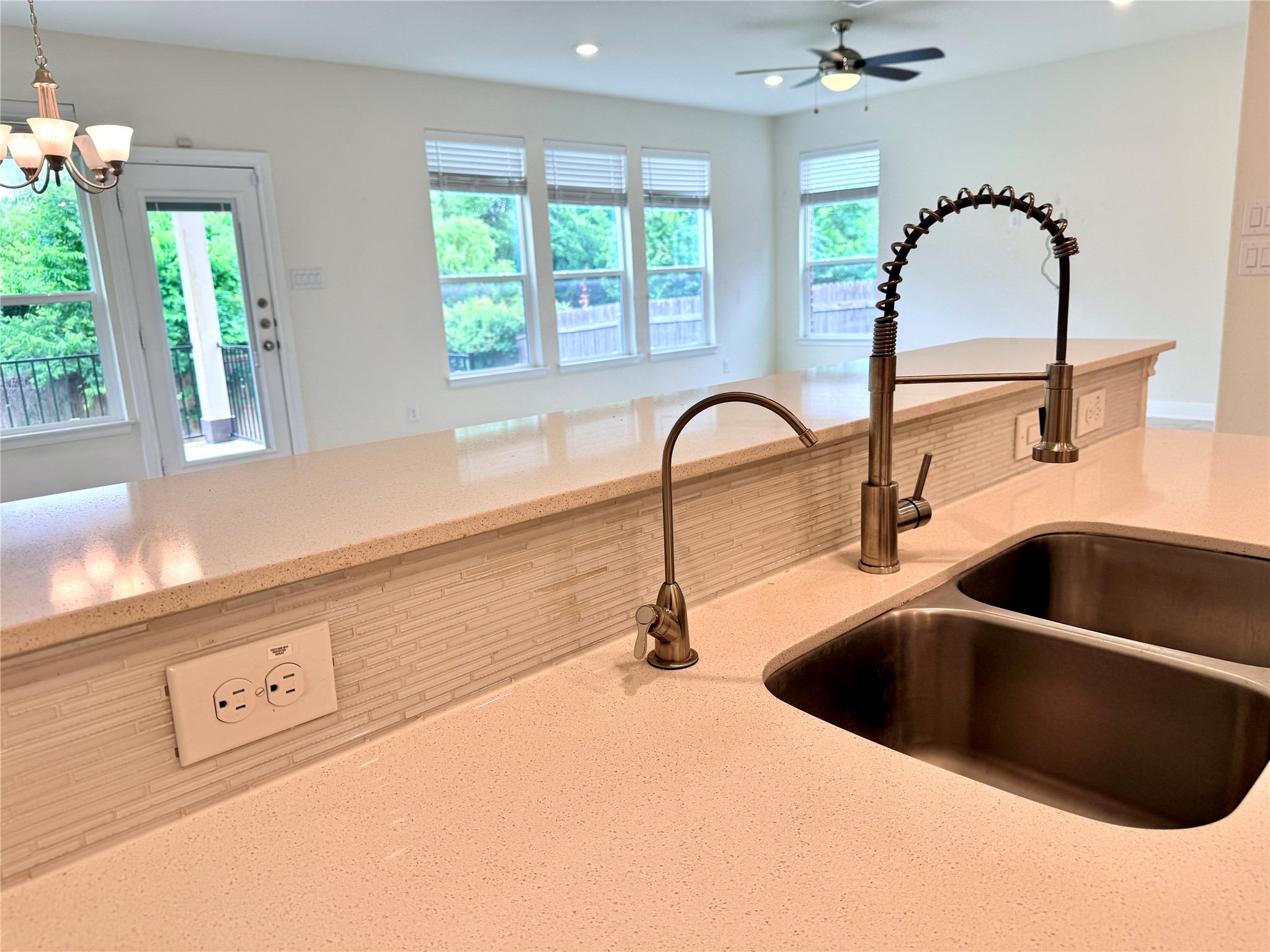 2101 Split Diamond Way, Unit 40 Round Rock, TX 78664 - Photo 7 of 32 A well-lit kitchen with sleek countertops and ample space for culinary endeavors.