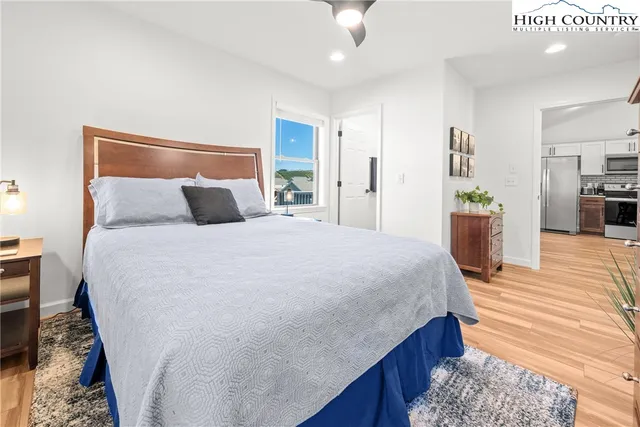 a bedroom with a bed and ceiling fan