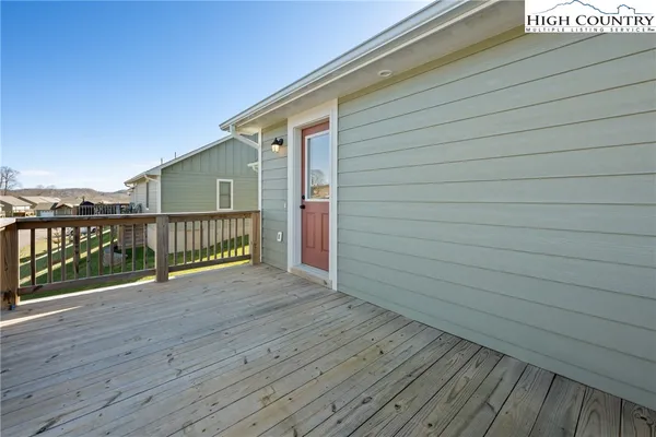 a view of deck with wooden floor and fence