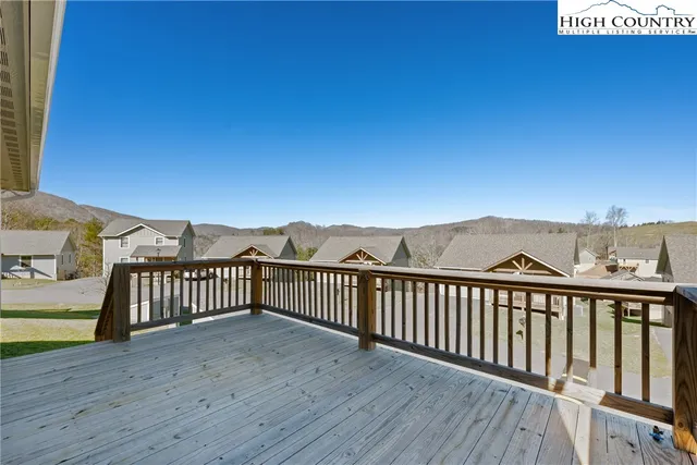 a view of balcony with wooden fence