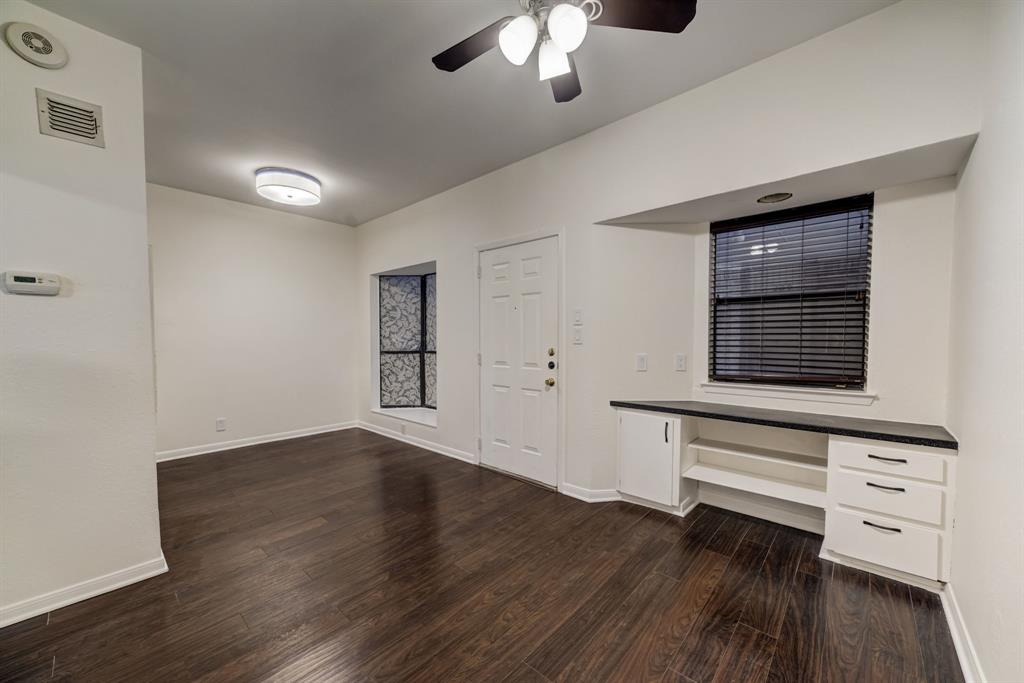 3316 Guadalupe Street, Unit 219 Austin, TX 78705 - Photo 3 of 13 wooden floor in an empty room with a window