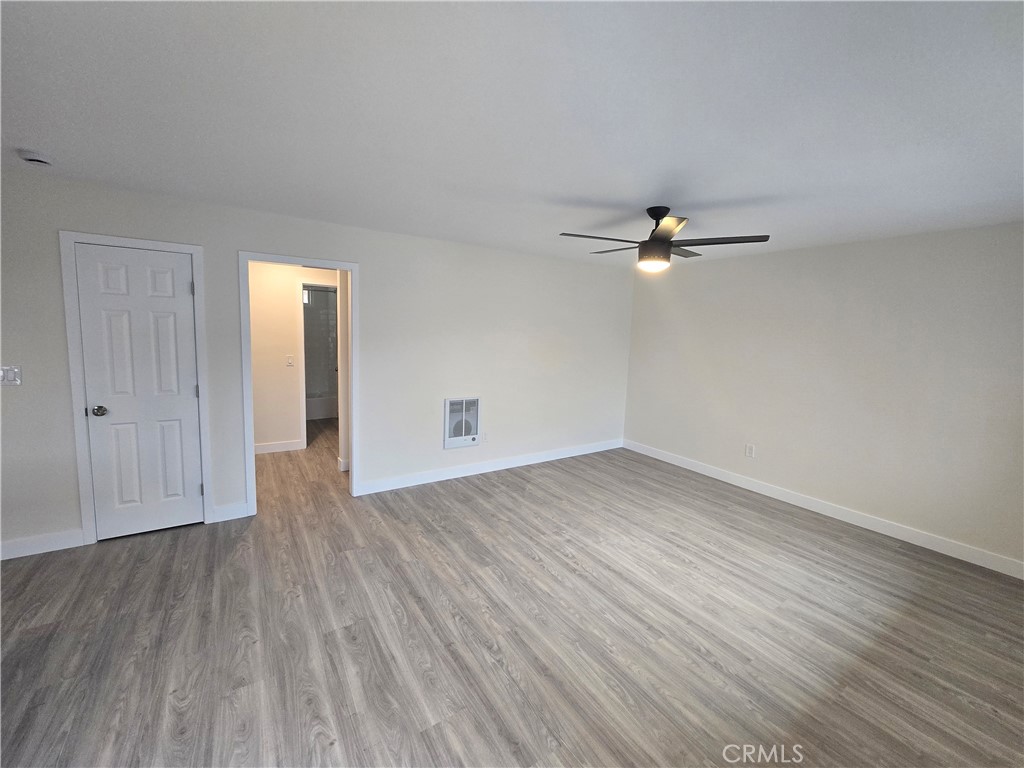6051 Lemon Avenue, Unit C Cypress, CA 90630 - Photo 11 of 16 wooden floor in an empty room with a window
