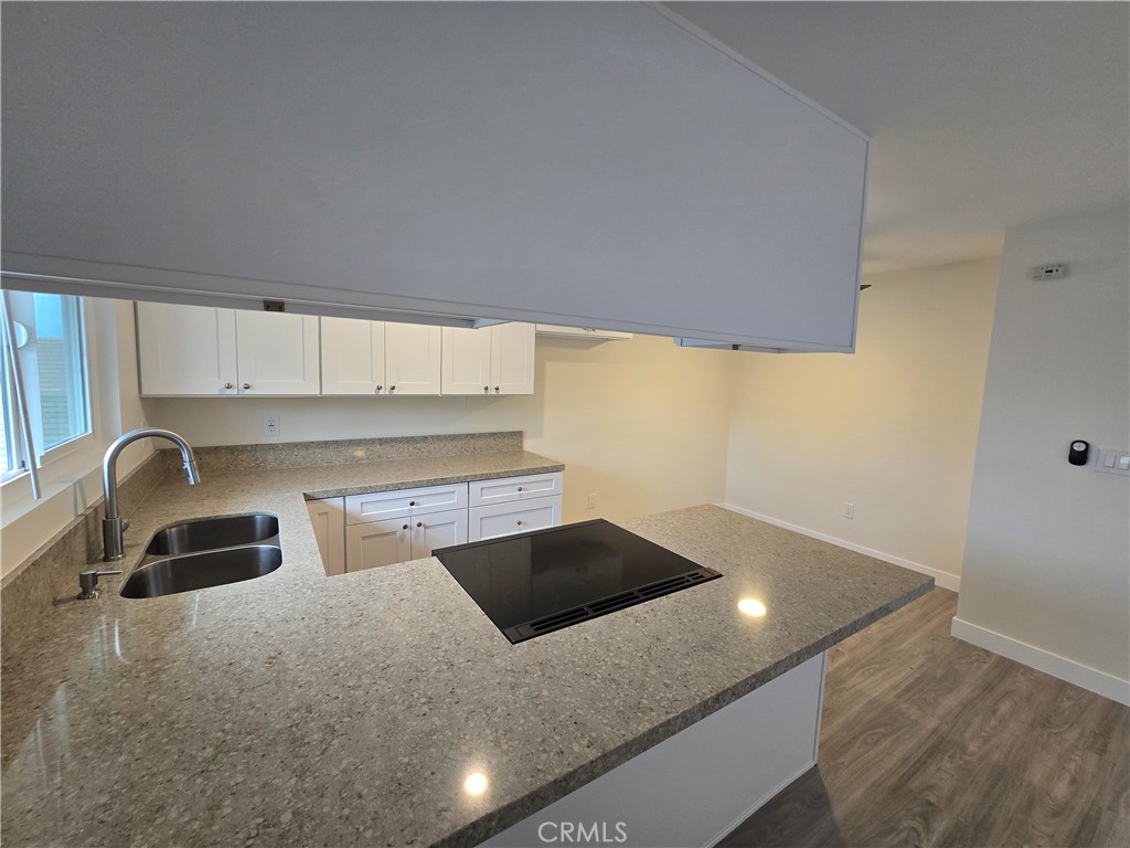 6051 Lemon Avenue, Unit C Cypress, CA 90630 - Photo 15 of 16 a kitchen with a stove and a sink