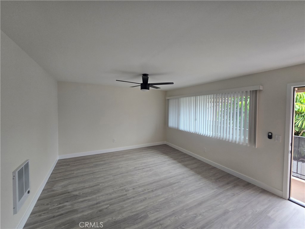 6051 Lemon Avenue, Unit C Cypress, CA 90630 - Photo 3 of 16 wooden floor in an empty room with a window