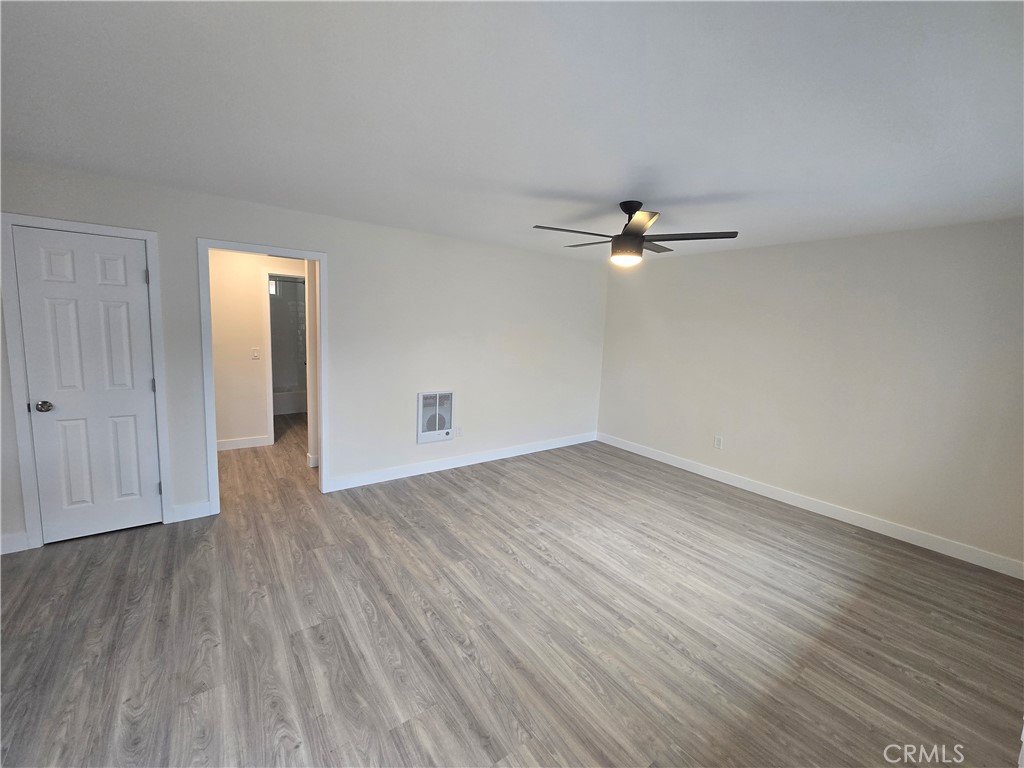 6051 Lemon Avenue, Unit C Cypress, CA 90630 - Photo 10 of 16 wooden floor in an empty room with a window