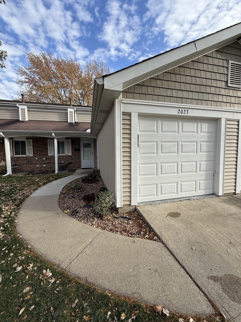 2023 Raleigh Place Hoffman Estates, IL 60169 - Photo 1 of 1 a front view of a house with a garage