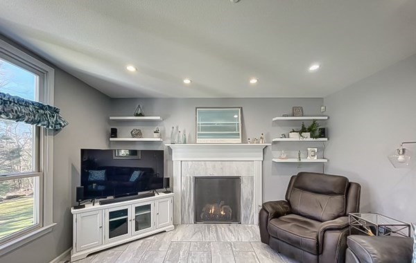 20 Warren Road Wilbraham, MA 01095 - Photo 16 of 41 a living room with furniture and a fireplace