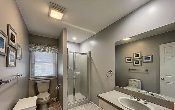 20 Warren Road Wilbraham, MA 01095 - Photo 22 of 41 a bathroom with a toilet a sink and glass door