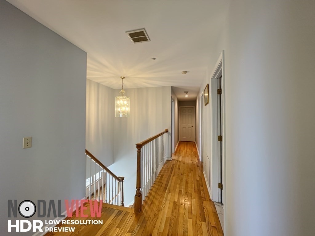 20 Warren Road Wilbraham, MA 01095 - Photo 25 of 41 a view of a hallway with wooden floor and staircase