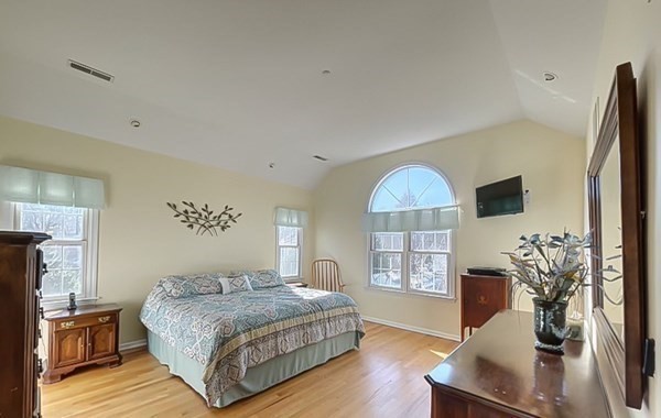 20 Warren Road Wilbraham, MA 01095 - Photo 26 of 41 a spacious bedroom with a bed and wooden floor