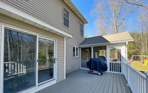 20 Warren Road Wilbraham, MA 01095 - Photo 33 of 41 a view of a house with a wooden deck and a large window