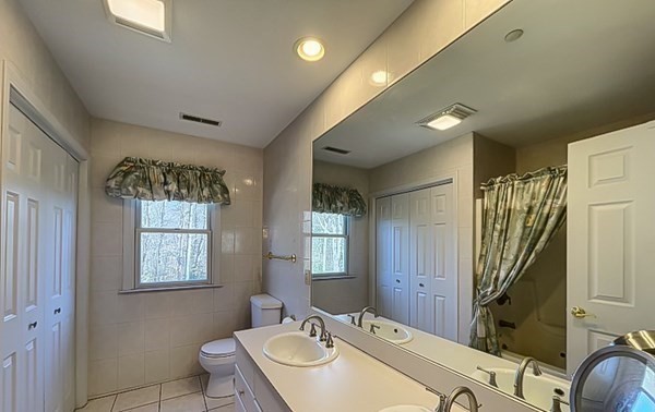 20 Warren Road Wilbraham, MA 01095 - Photo 34 of 41 a bathroom with a sink a mirror and a bathtub