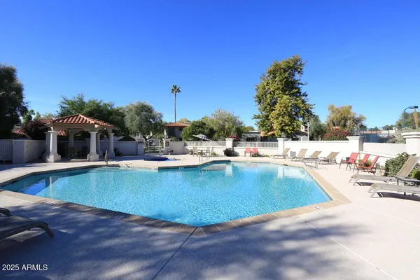 a view of a swimming pool with a patio