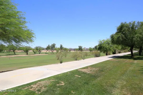 a view of a golf course with a lake