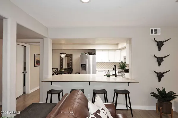 a dining room with furniture and window
